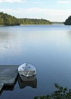 Calm lake in Sweden during the morning hours photo