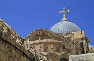 Cross on top of the Church of the Holy Sepulchre in Jerusalem, Israel photo
