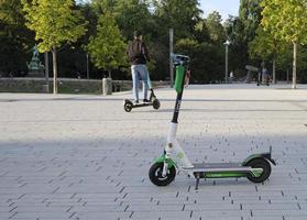 Dusseldorf, Germany - August 30, 2019 - E-mobility in Germany. E-scooters waiting for customers next to a street in Dusseldorf, Germany. photo