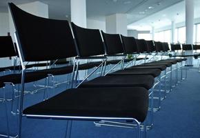 Rows of empty chairs before the start of a convention photo