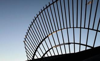 Border gate detail against a blue sky photo