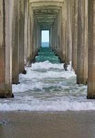 Under the pier at Scripps Beach, San Diego photo