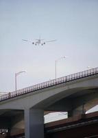 Aircraft noise - low-flying air plane during its approach photo