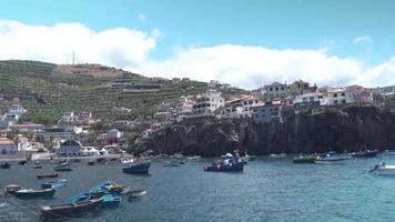 Boats gather around sea port village video