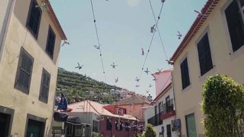 Festive flags line the space between two housing buildings video