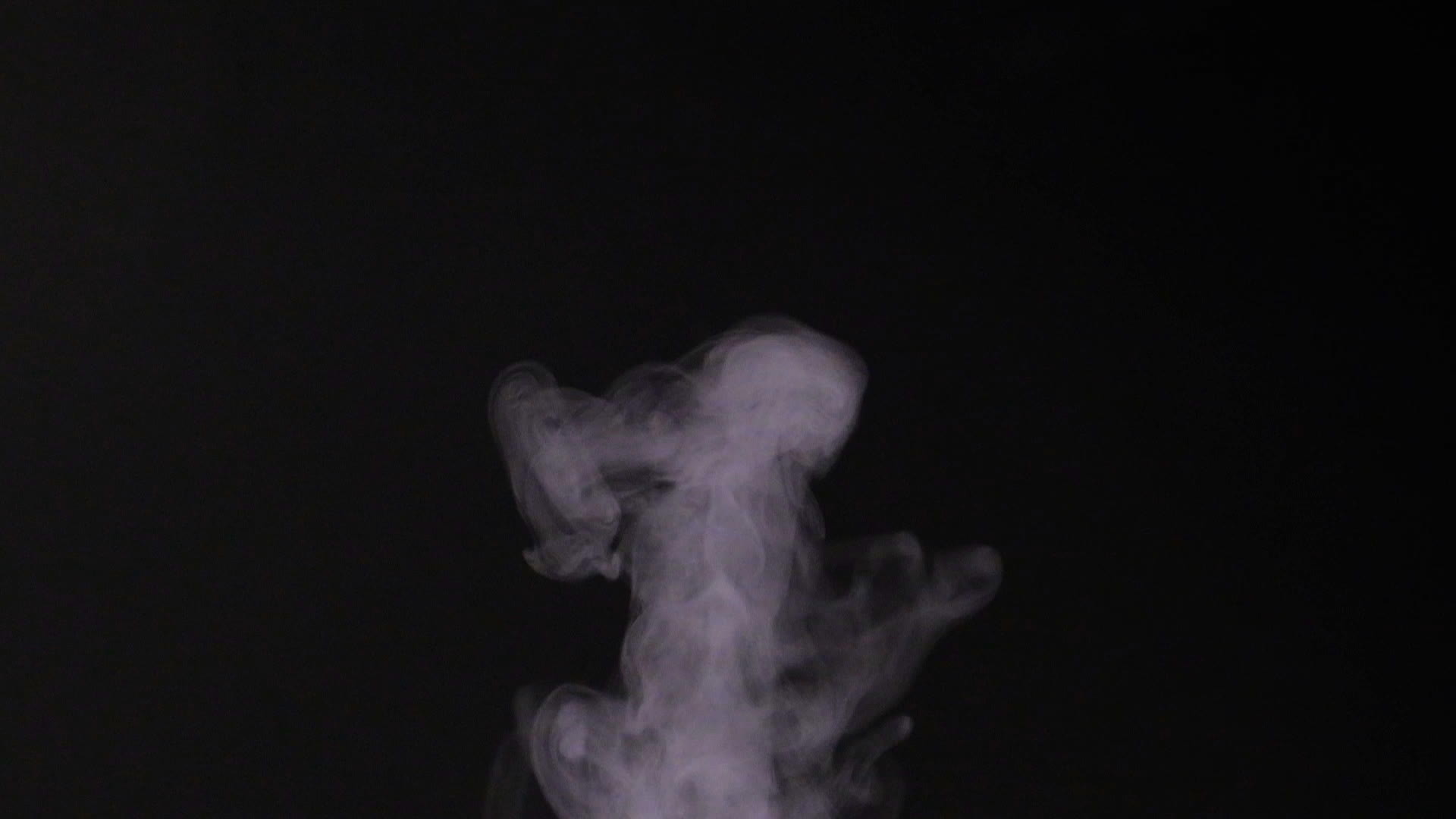 Smoke on black background in slow motion, steam mist on black