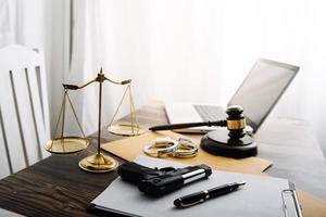 justice and law concept.Male judge in a courtroom on wooden table and Counselor or Male lawyer working in office. Legal law, advice and justice concept. photo