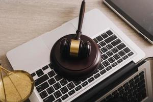 Male lawyer working with contract papers and wooden gavel on tabel in courtroom. justice and law ,attorney, court judge, concept. photo