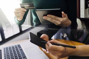 Businessman and team analyzing financial statement Finance task. with smart phone and laptop and tablet. Wealth management concept photo