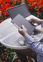 Agriculture technology farmer woman holding tablet or tablet technology to research about agriculture problems analysis data and visual icon. photo