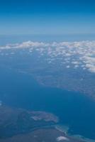 Bali island in tropical sea, veiw from airplane sight photo
