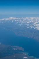 Bali island in tropical sea, veiw from airplane sight photo