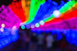 colorful light bokeh background on dark photo