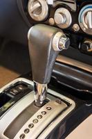 Closeup detail of modern car interior. Automatic transmission car select focus photo
