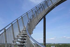 Career steps concept - a steep upward flight of stairs in front of the afternoon sky photo