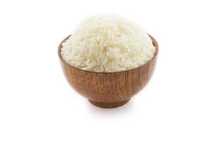 Wooden bowl full of Jasmine rice on white background. Thai rice photo