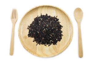 Rice berry in wooden bowls with spoon and fork on white background. concept photo