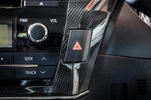 car emergency light button in interior details modern car photo