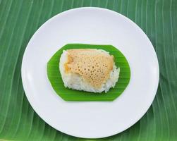 sticky rice with steamed custard on banana leaves and dish, sweet sticky rice, Thai sweet dessert, original Thai food photo