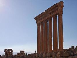 Silhouette of a man next to Roman ruins in Baalbek, Lebanon photo