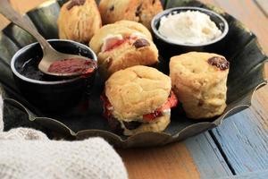 British Scones with Clotted Cream and Strawberry Jam for Afternoon Tea Time photo