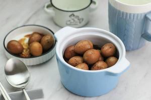 Close Up Semur Telur Puyuh  is Boiled Eggs Cook with Soy Sauce for Family Menu photo