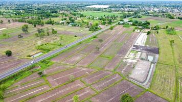 Aerial view of green fields and farmlands in rural Thailand. photo