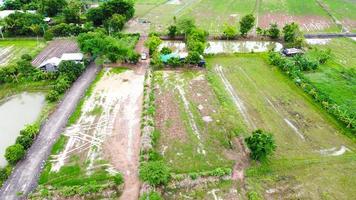 Aerial view of green fields and farmlands in rural Thailand. photo