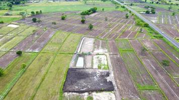 Aerial view of green fields and farmlands in rural Thailand. photo