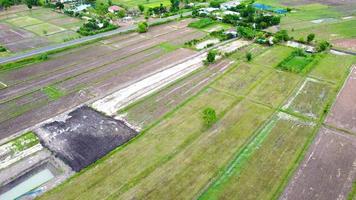 Aerial view of green fields and farmlands in rural Thailand. photo