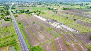 Aerial view of green fields and farmlands in rural Thailand photo