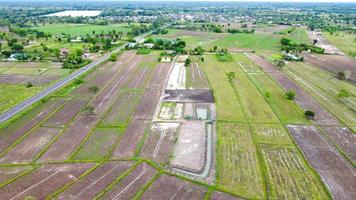 Aerial view of green fields and farmlands in rural Thailand photo