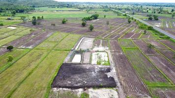 Aerial view of green fields and farmlands in rural Thailand. photo