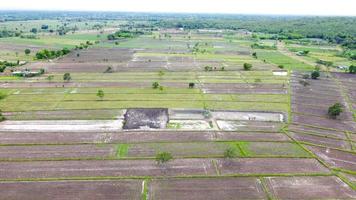 Aerial view of green fields and farmlands in rural Thailand. photo