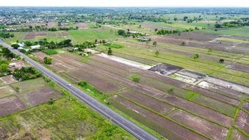 Aerial view of green fields and farmlands in rural Thailand. photo