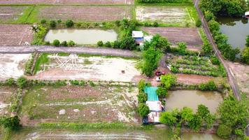 Aerial view of green fields and farmlands in rural Thailand. photo