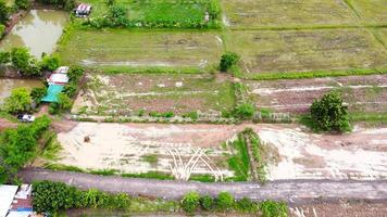 Aerial view of green fields and farmlands in rural Thailand. photo