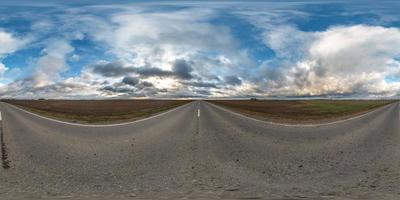 full seamless spherical hdri panorama 360 degrees angle view on asphalt road among fields in autumn day with beautiful clouds in equirectangular projection, ready for VR AR virtual reality content photo