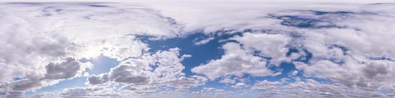 Seamless hdri panorama 360 degrees angle view blue sky with beautiful fluffy cumulus clouds with zenith for use in 3d graphics or game development as sky dome or edit drone shot photo