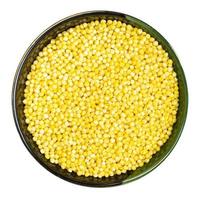 polished proso millet in round bowl isolated photo