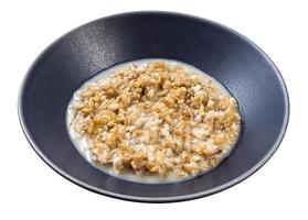 porridge from wholegrain oat in gray bowl isolated photo