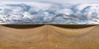 full seamless spherical hdri panorama 360 degrees angle view on asphalt road among fields in autumn day with beautiful clouds in equirectangular projection, ready for VR AR virtual reality content photo