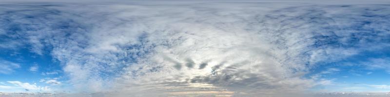 Seamless hdri panorama 360 degrees angle view blue sky with beautiful fluffy cumulus clouds with zenith for use in 3d graphics or game development as sky dome or edit drone shot photo