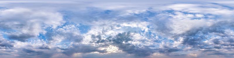 Seamless hdri panorama 360 degrees angle view blue sky with beautiful fluffy cumulus clouds before rain with zenith for use in 3d graphics or game development as sky dome or edit drone shot photo