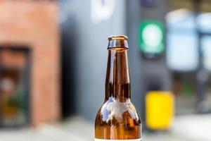 open brown glass bottle close up outdoors photo