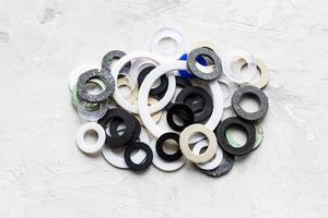 pile of various gaskets for plumbing water systems photo