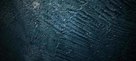 Dark black stone background. scary black concrete texture. Stone wall background. photo