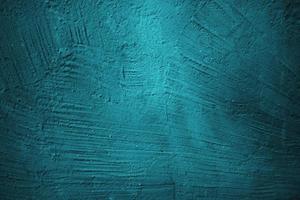 Abstract grunge blue stucco wall background. Dark stone wall concept background with space for text. photo