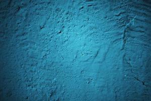 Abstract grunge blue stucco wall background. Dark stone wall concept background with space for text. photo