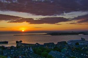 Heligoland - look on the island dune - sunrise over the sea photo